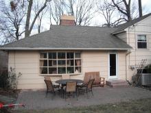 The back of the home features a large bay window.