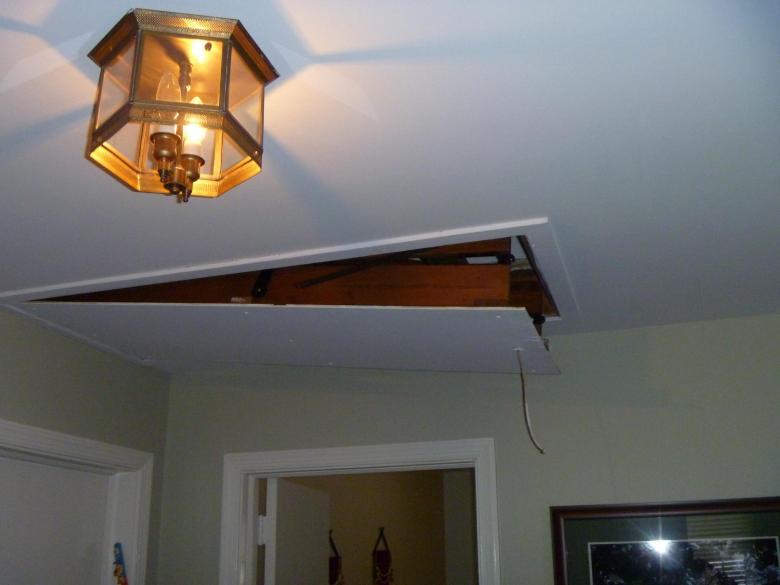 The newly insulated and air sealed attic hatch, ajar in the living room.